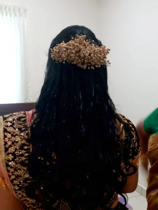 image of a bride with classy hair-do by Srihayaas Bridal Studios