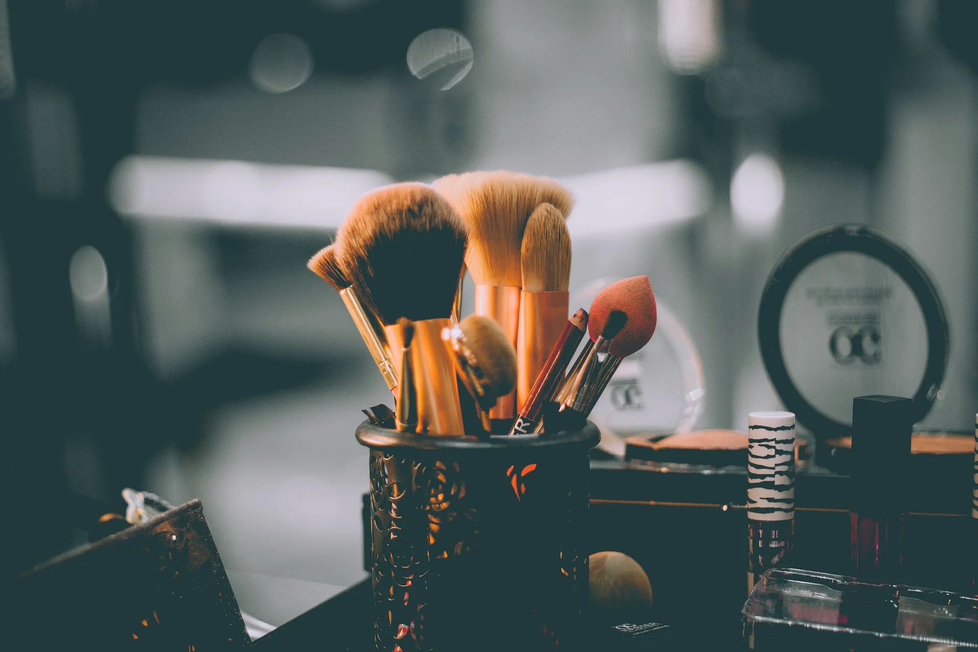 dark image of a set of makeup brushes